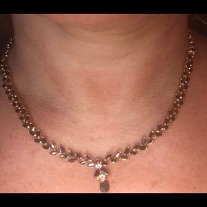 Metallic gold with black and white stone